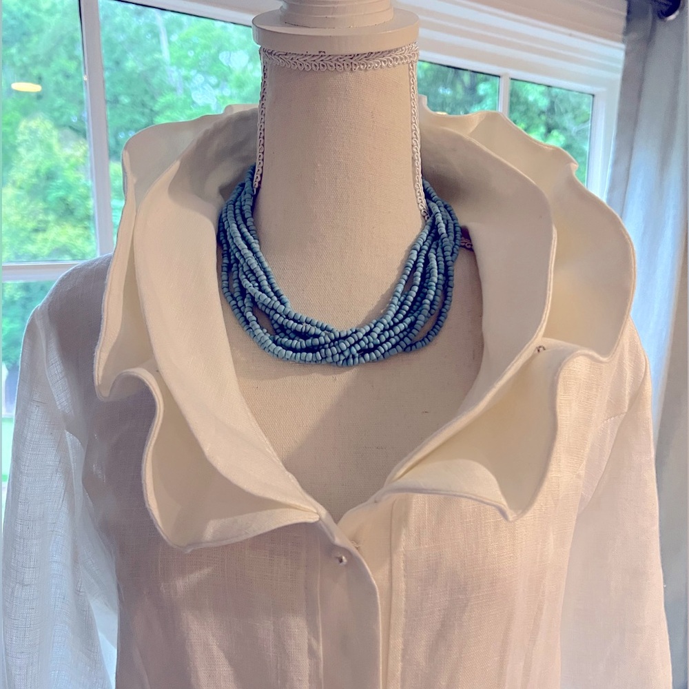 Elegant white linen top with stylish collar
